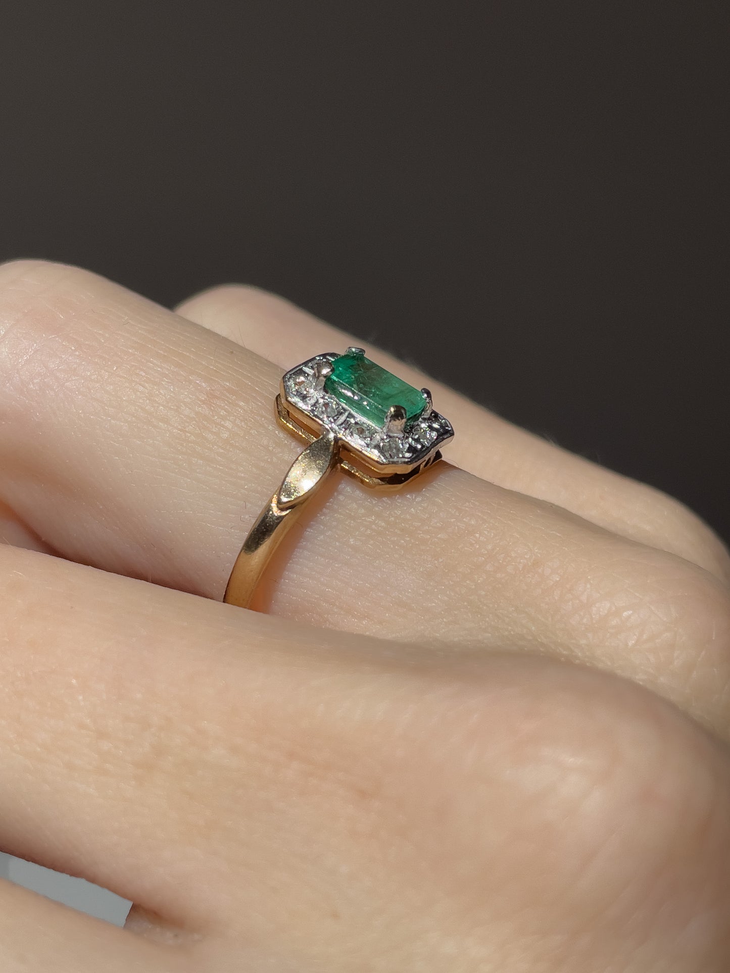 Vintage emerald and diamond halo ring on 9ct gold