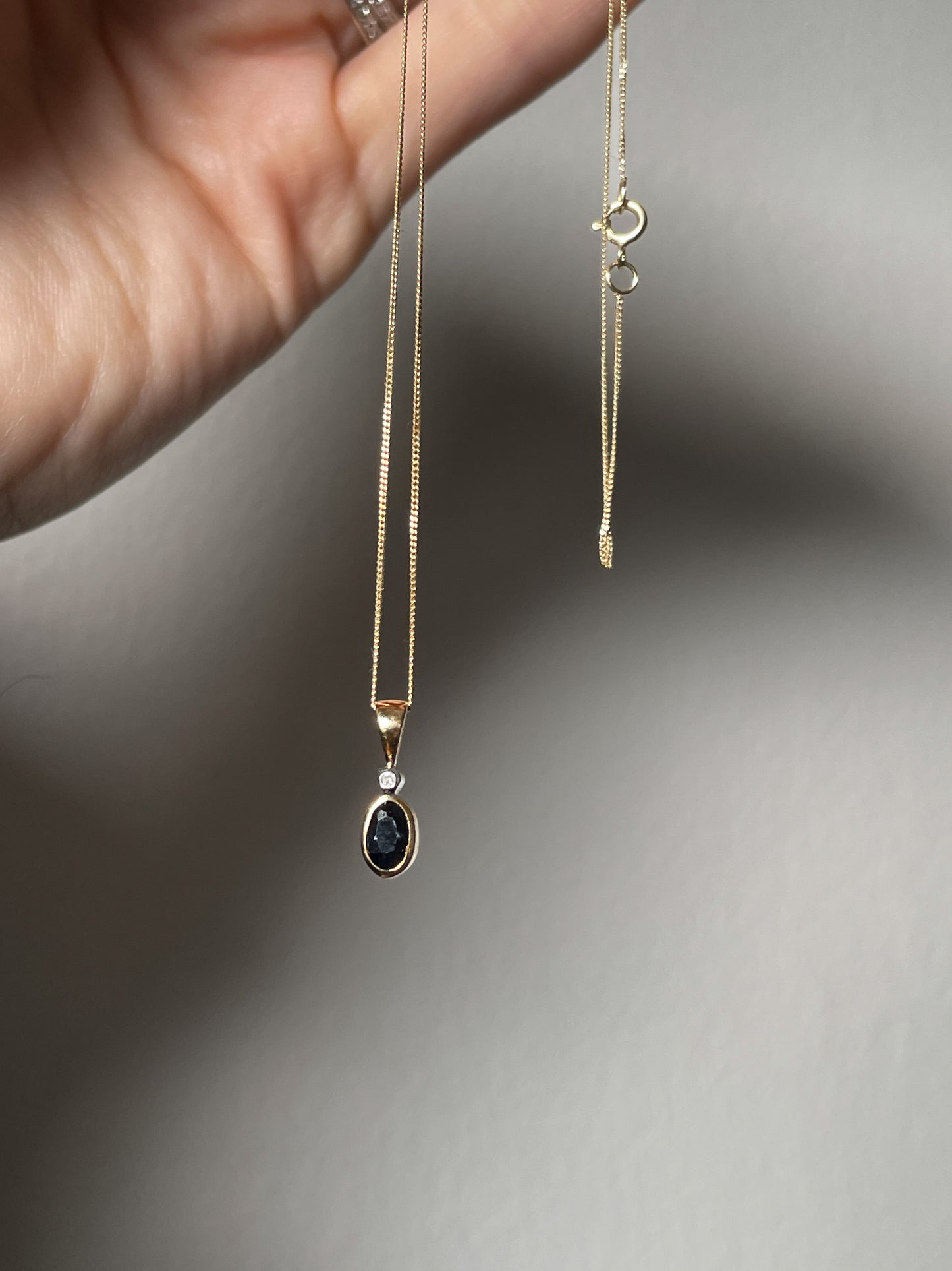Sapphire and diamond necklace pendant on 9ct gold chain