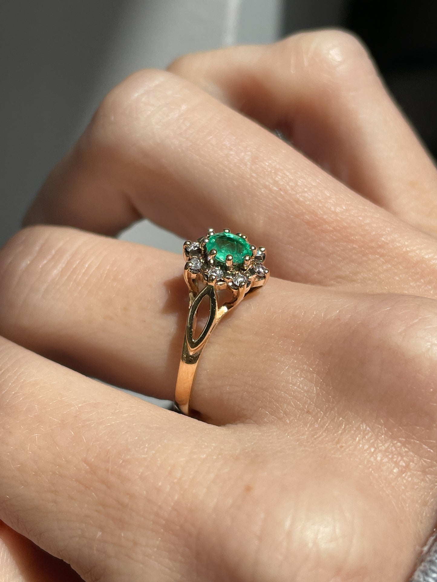Vintage emerald and diamond halo cluster ring on 9ct gold