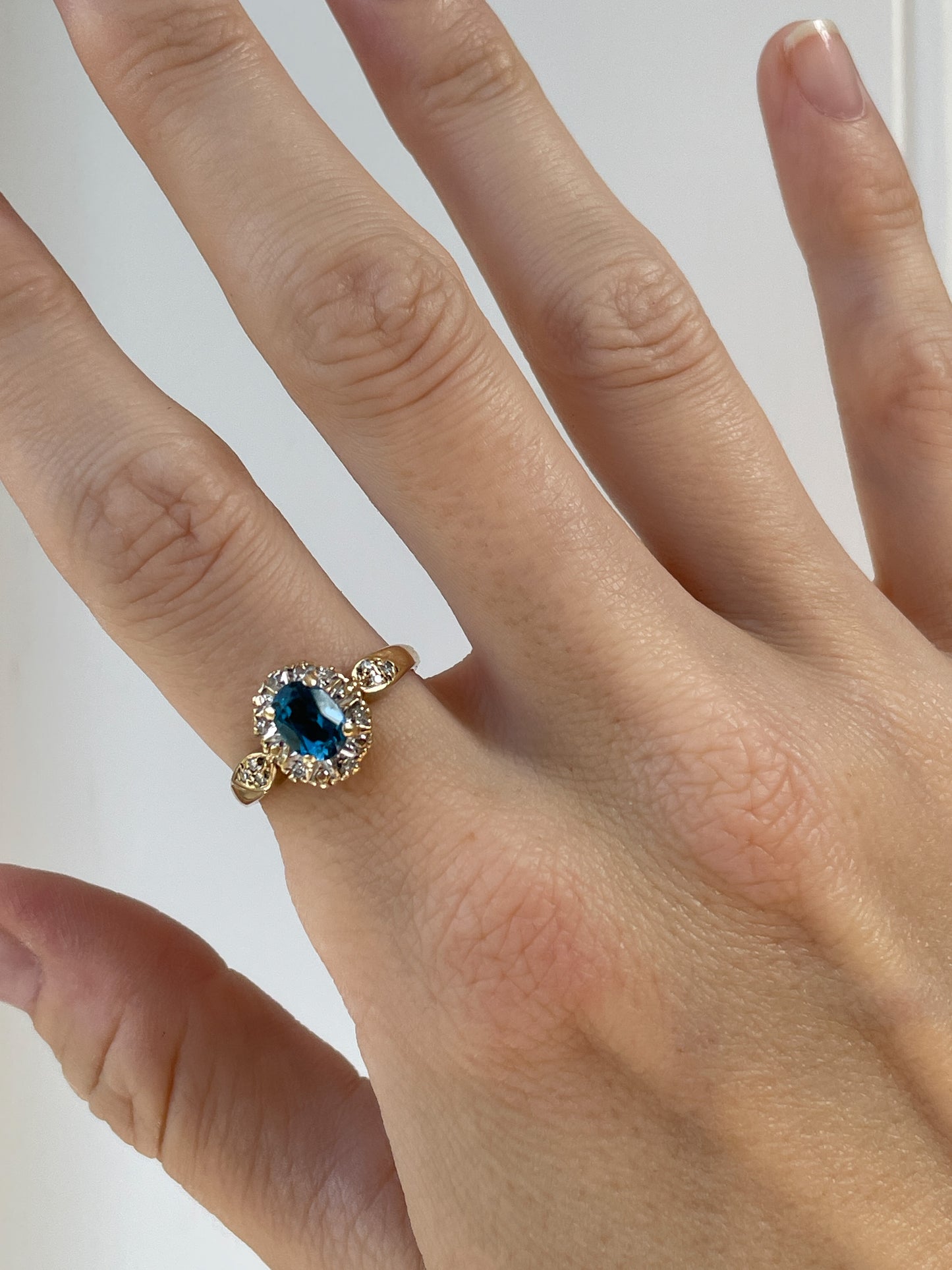 Vintage blue topaz and diamond halo ring on 9ct gold