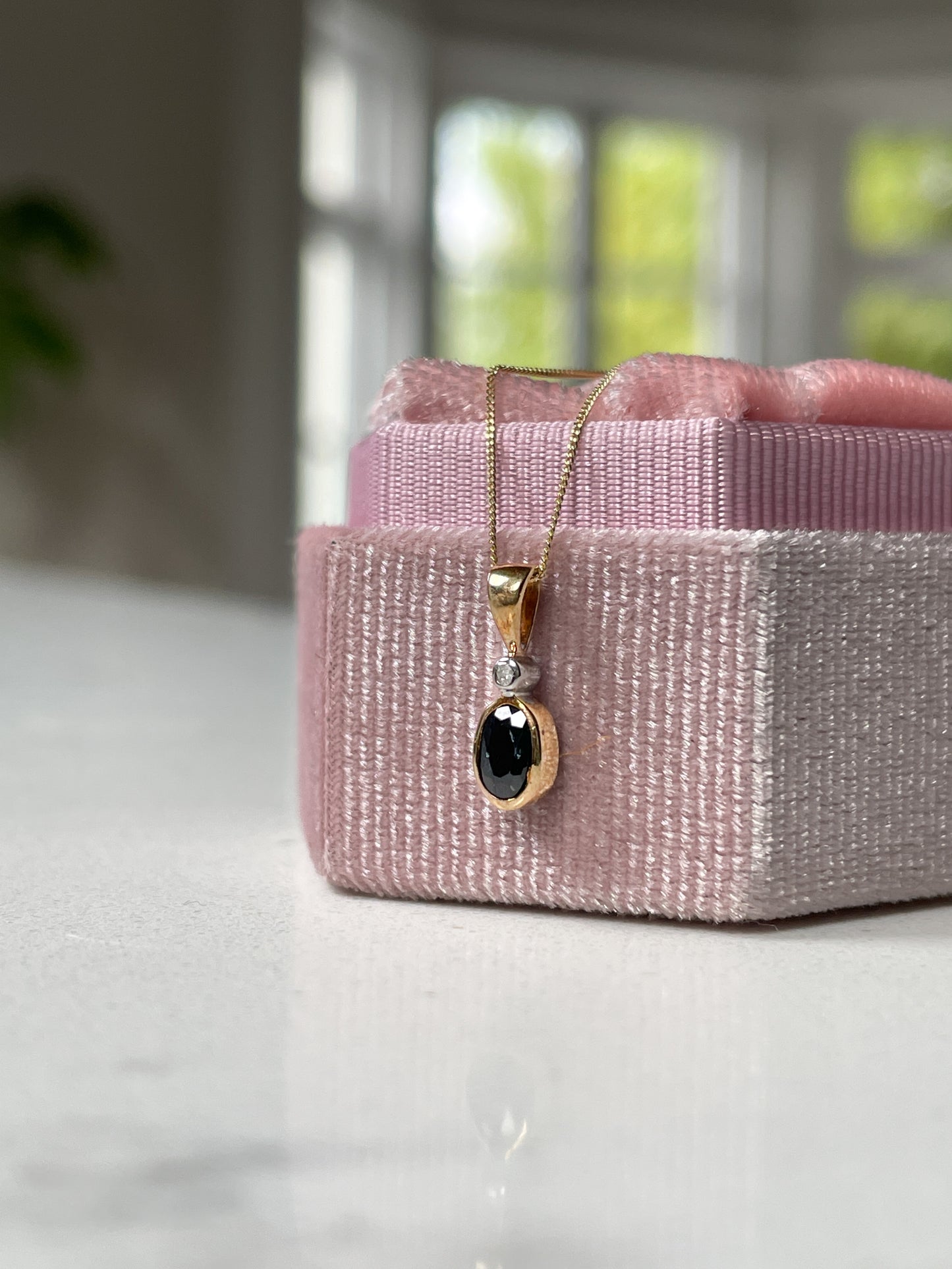Sapphire and diamond necklace pendant on 9ct gold chain