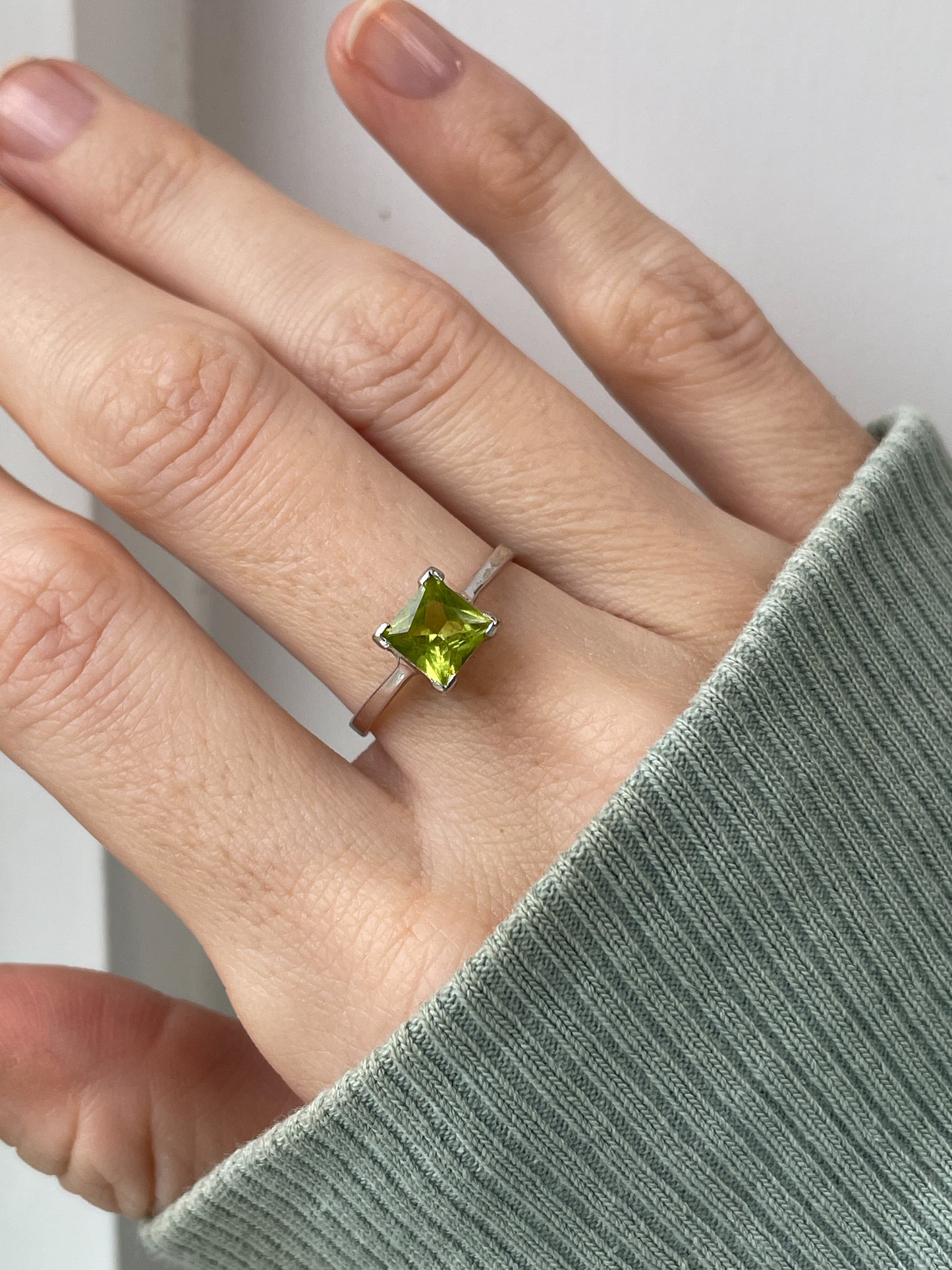 Peridot solitaire ring on 9ct white gold