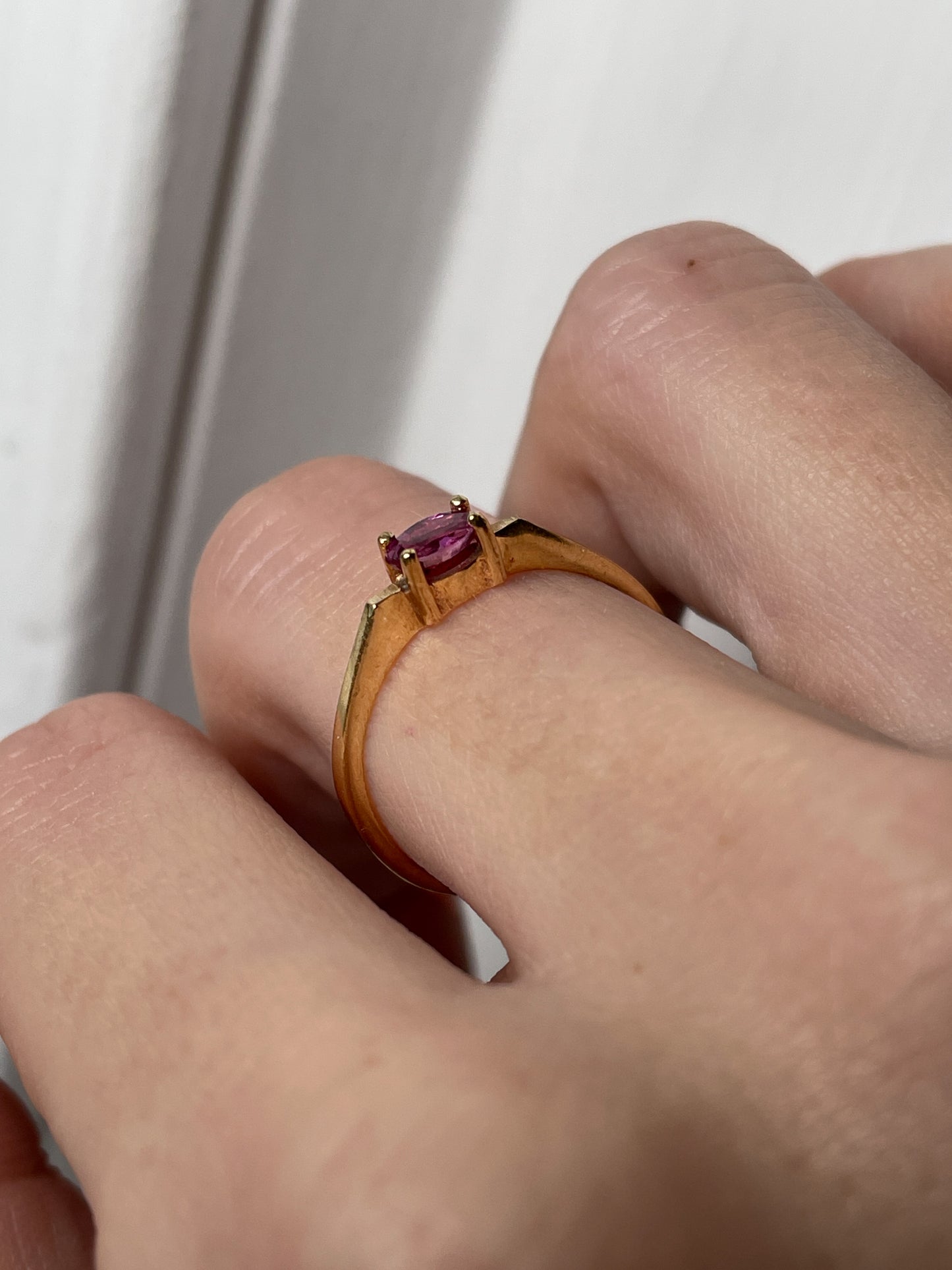 A vintage 9ct gold east-west ruby ring