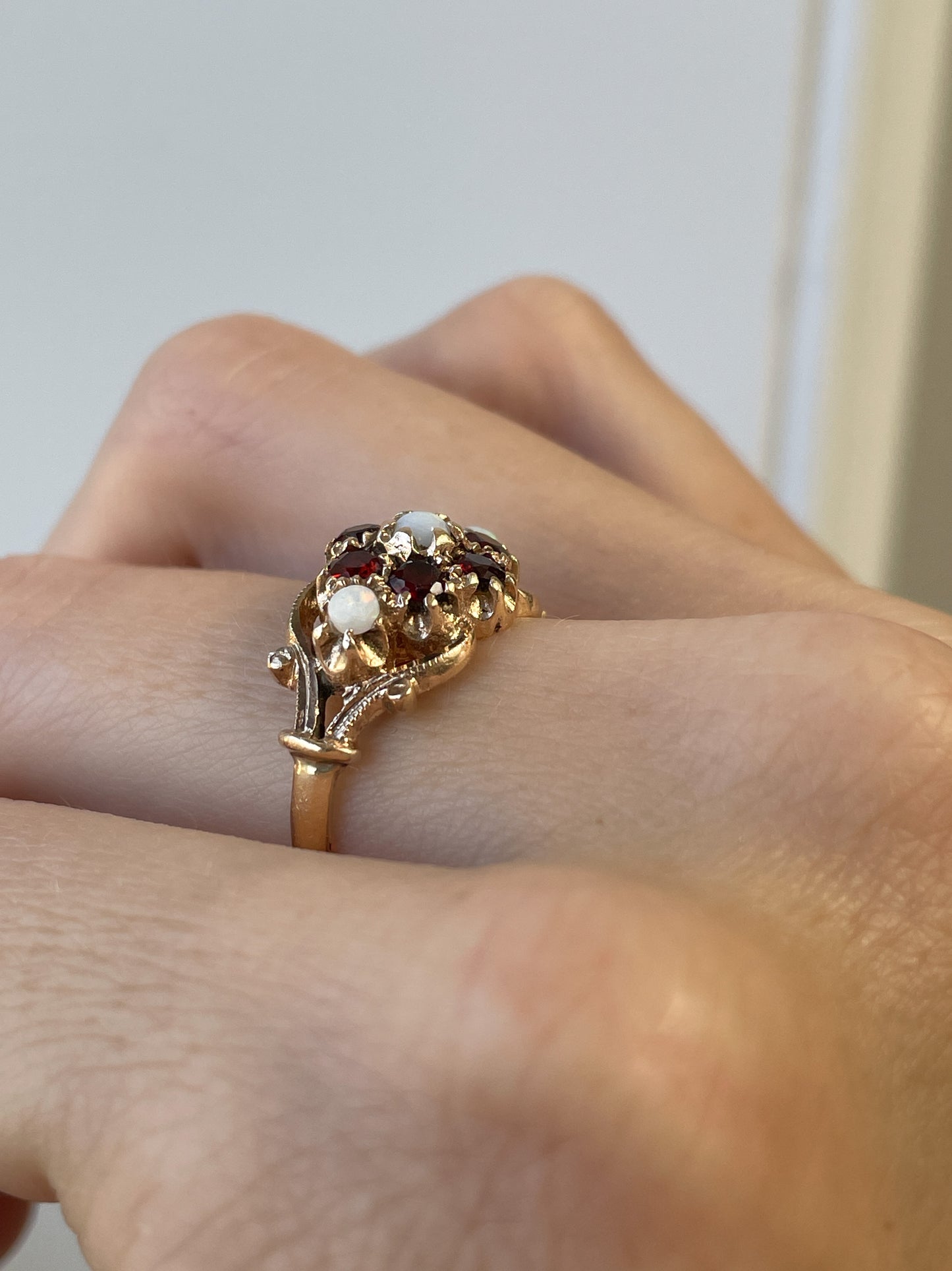 Antique garnet and opal halo ring on 9ct gold