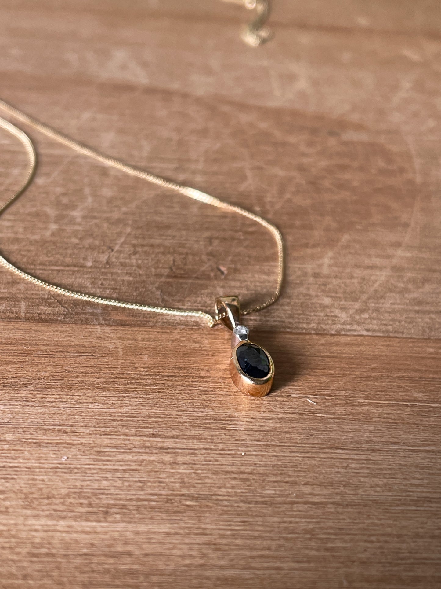 Sapphire and diamond necklace pendant on 9ct gold chain