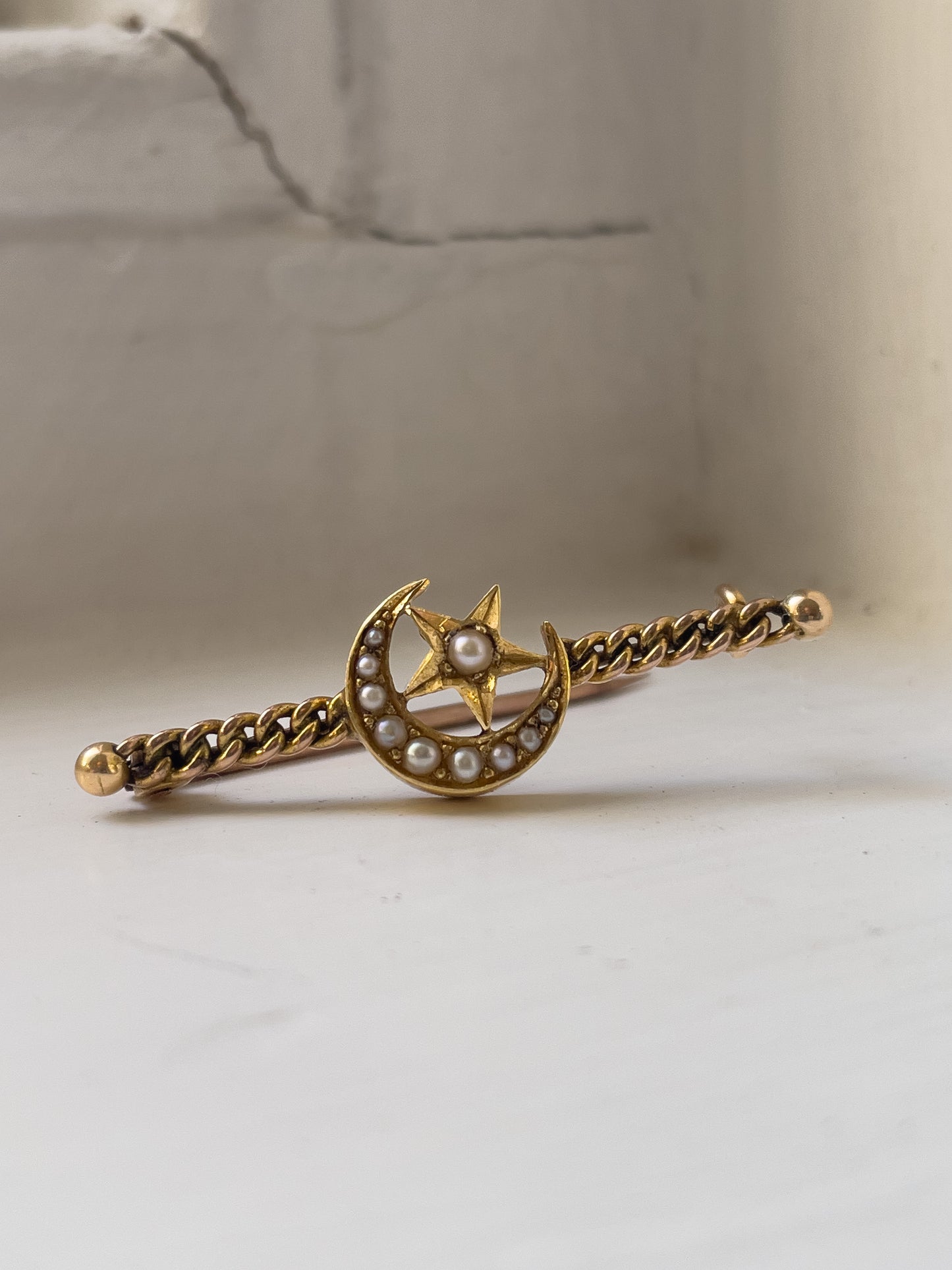 Antique seed pearl star and crescent moon brooch on 15ct gold