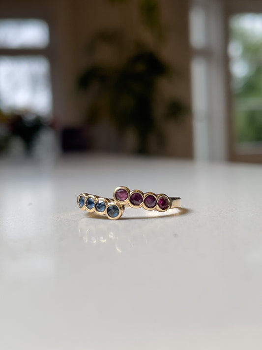 Vintage 8-stone sapphire and ruby bypass ring on 9ct gold
