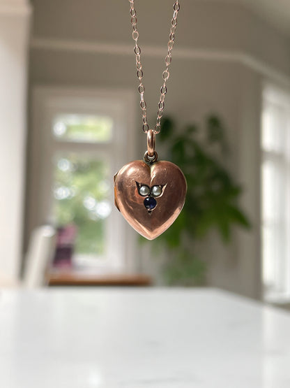Antique pearl and sapphire heart locket with chain, on 9ct rose gold