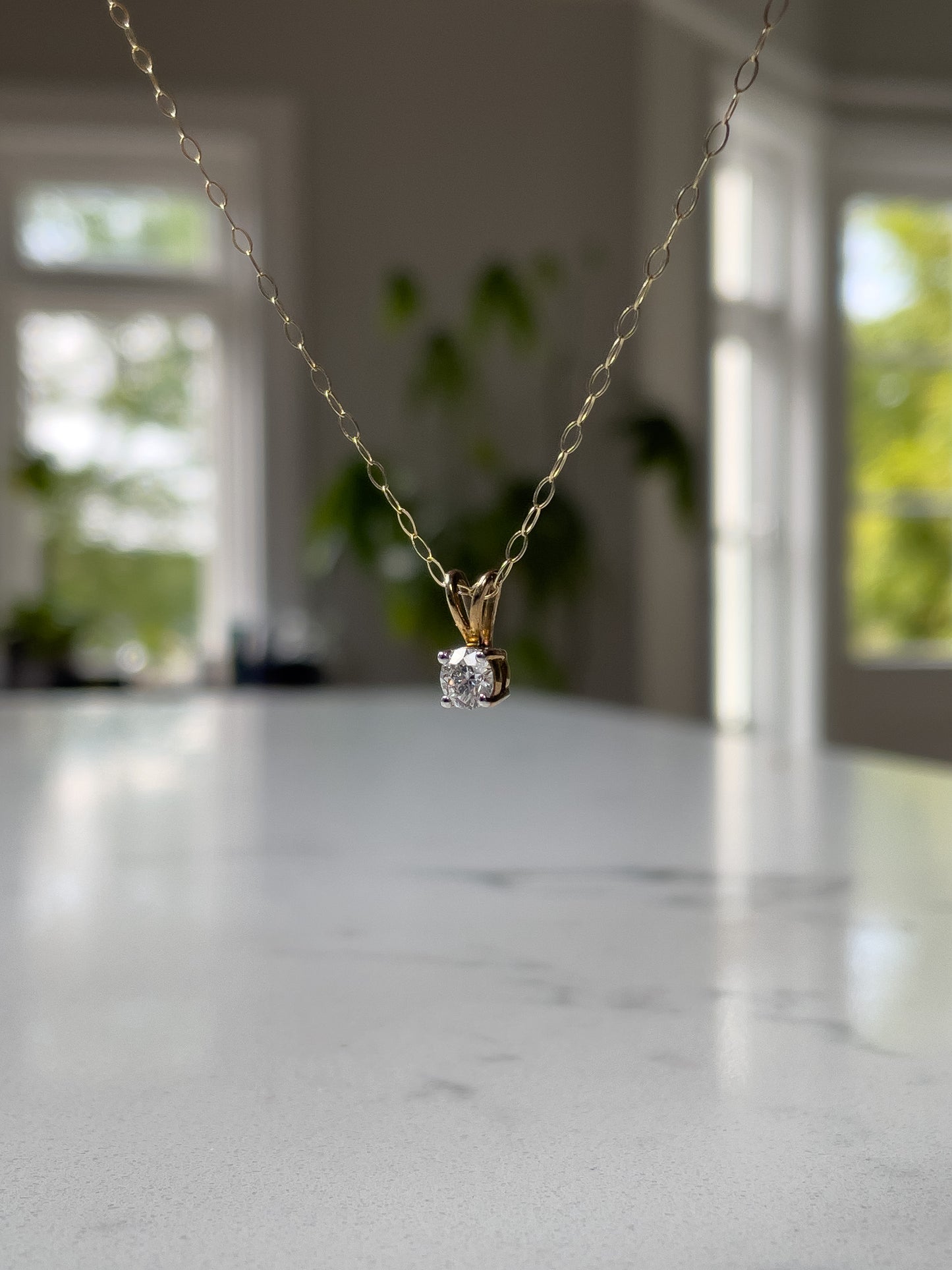 Vintage .25ct diamond solitaire pendant and chain