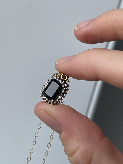 Vintage 1.25ct sapphire and diamond halo pendant with 9ct gold chain