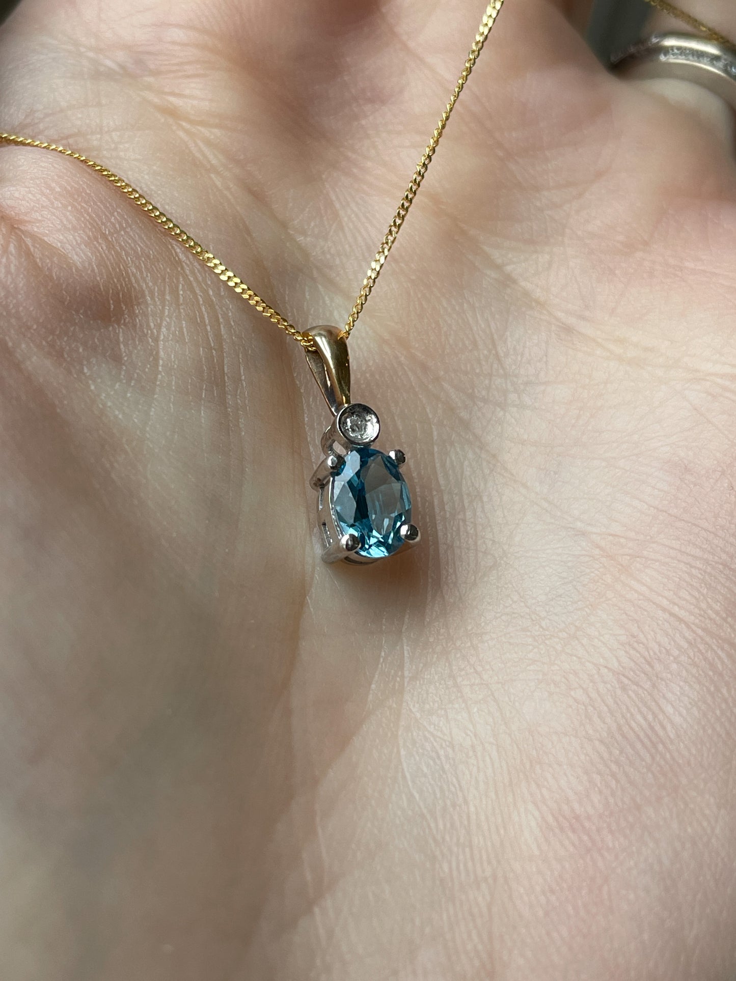 Blue topaz and diamond necklace