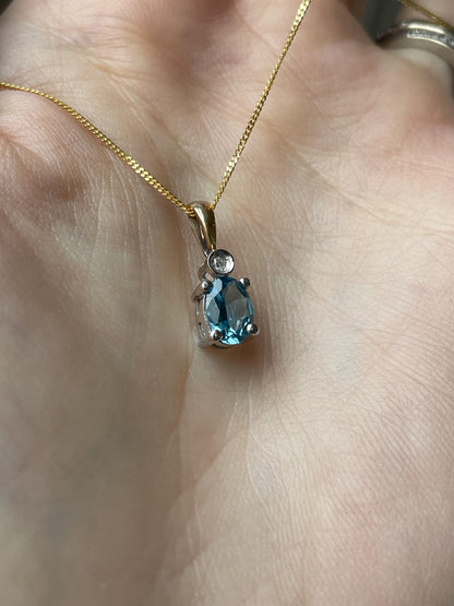 Blue topaz and diamond necklace