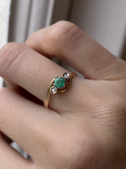 A vintage emerald and diamond trilogy ring on 9ct gold