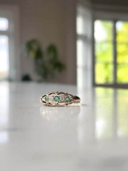 Vintage emerald and diamond boat ring on 9ct gold