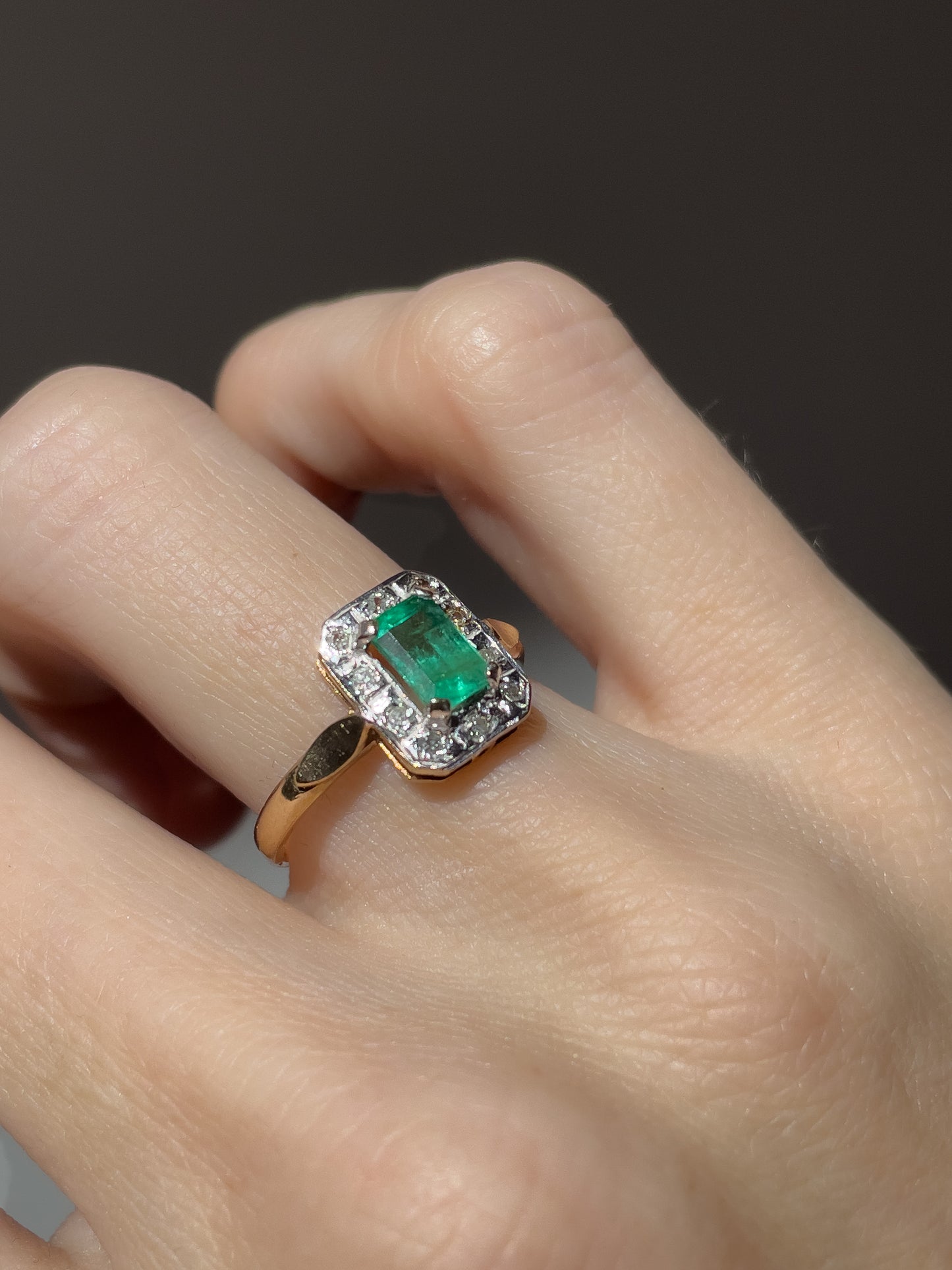 Vintage emerald and diamond halo ring on 9ct gold