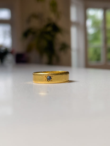A vintage 22ct gold star set sapphire ring