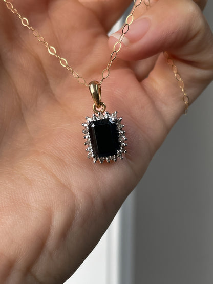 Vintage 1.25ct sapphire and diamond halo pendant with 9ct gold chain