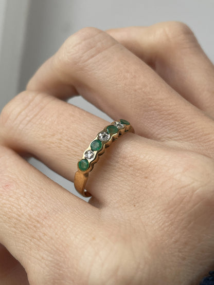 Vintage diamond and emerald 7-stone half eternity ring