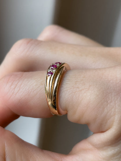 A vintage ruby and diamond crossover band ring on 9ct gold