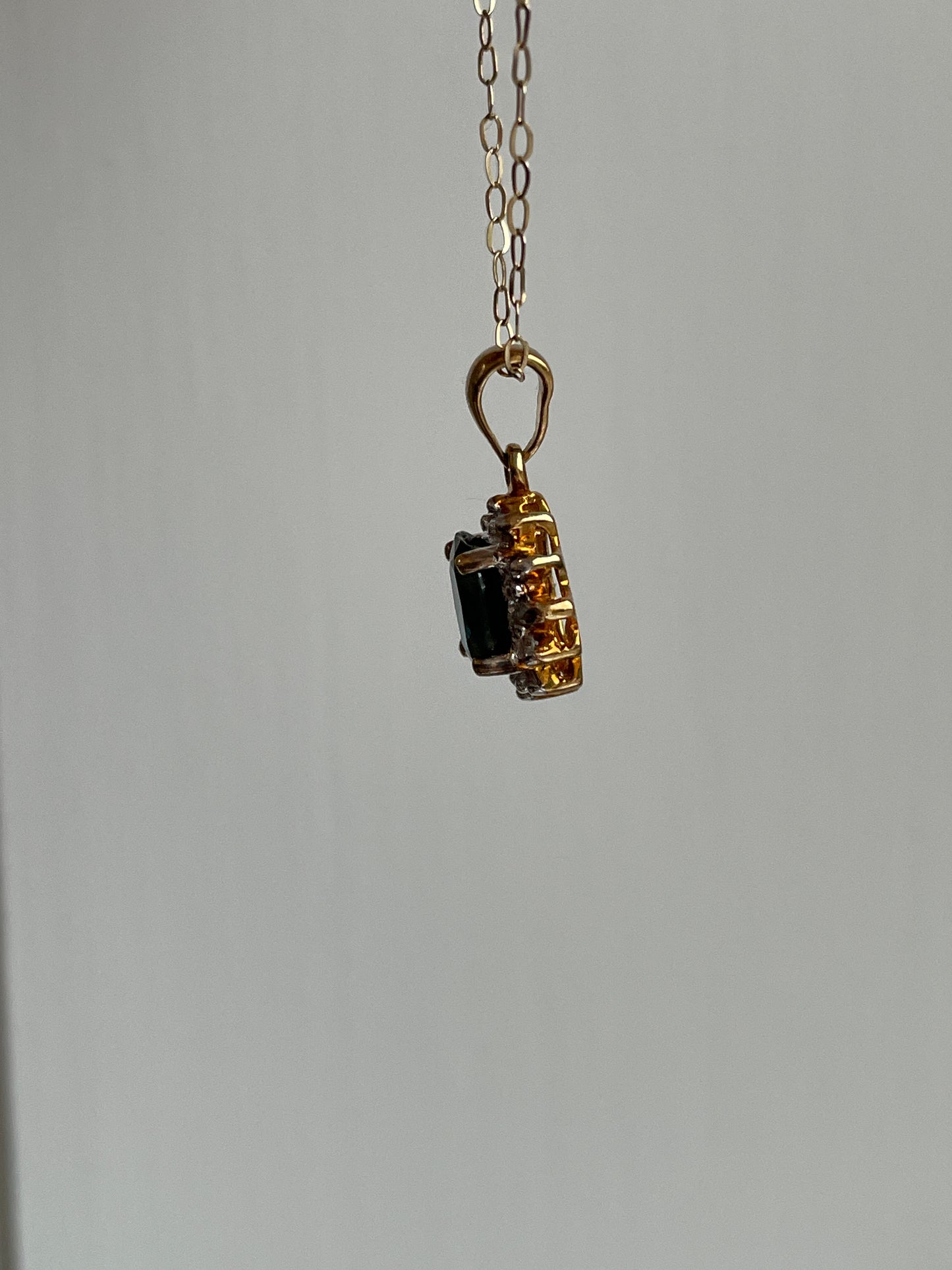 Vintage sapphire and diamond halo cluster pendant and 9ct gold chain