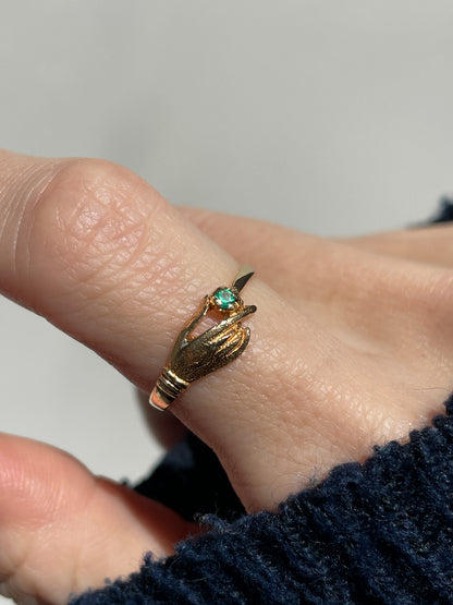 Antique gold hand and emerald ring on 18ct gold