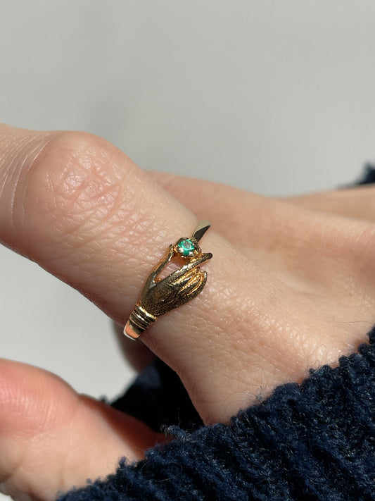 Antique gold hand and emerald ring on 18ct gold