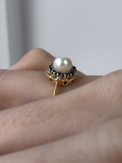 1960s Pearl and sapphire halo ring on 18ct gold