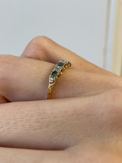 Vintage emerald and diamond half eternity ring on 9ct gold
