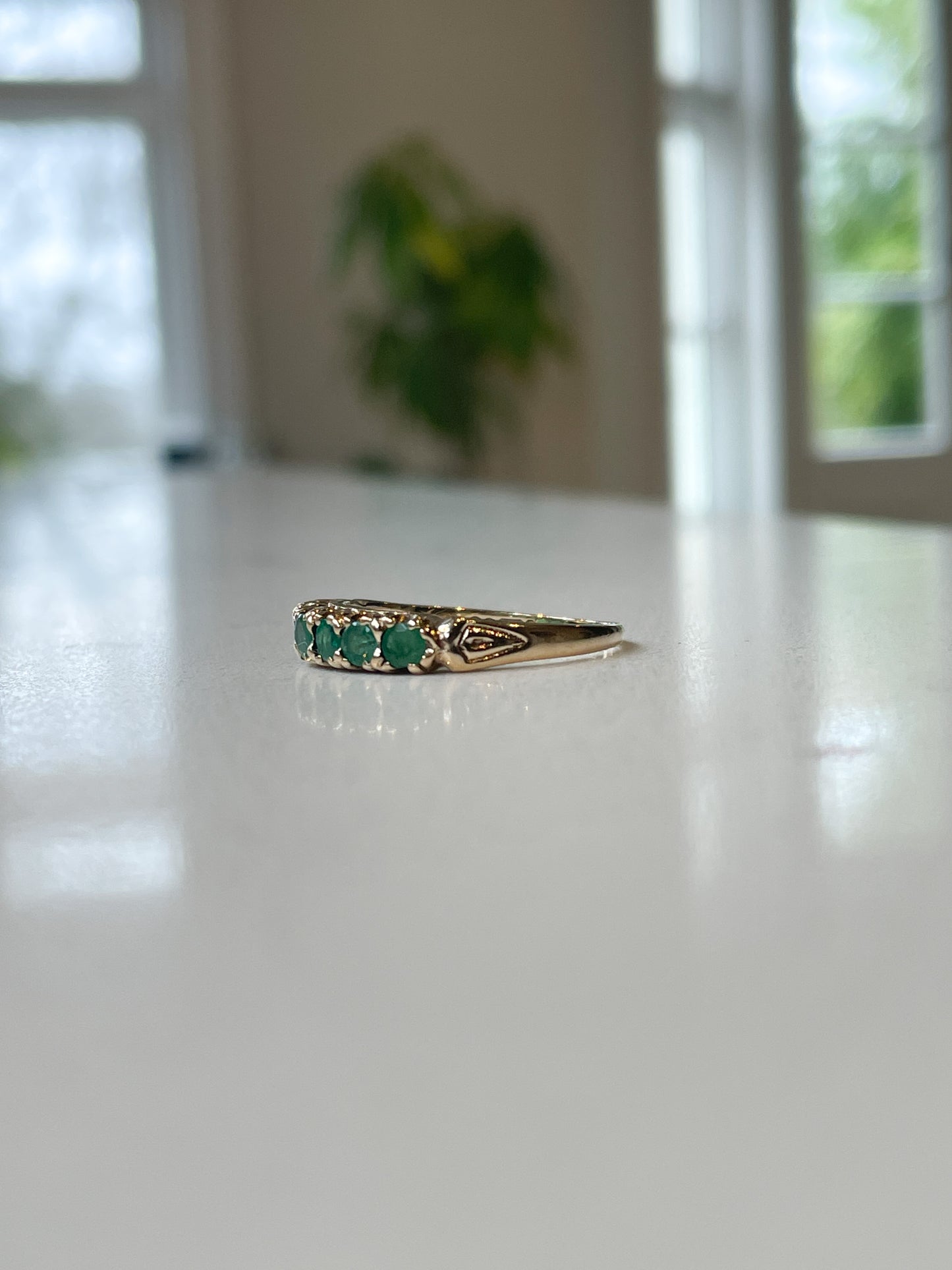 Vintage 7-stone emerald half eternity ring on 9ct gold