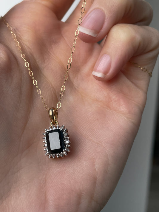 Vintage 1.25ct sapphire and diamond halo pendant with 9ct gold chain