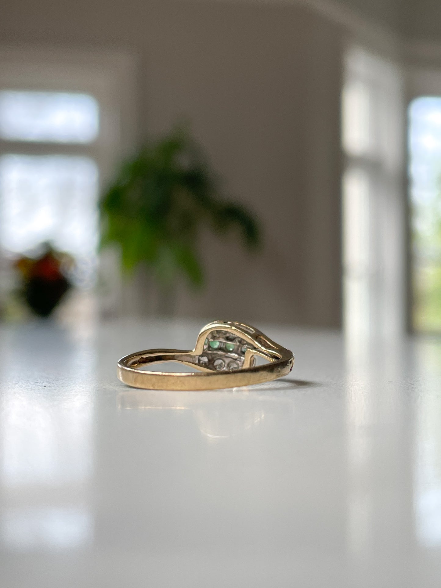 9ct gold emerald and diamond bypass ring from 1982