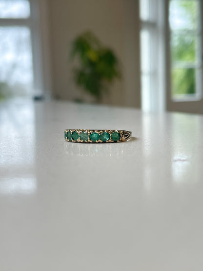 Vintage 7-stone emerald half eternity ring on 9ct gold