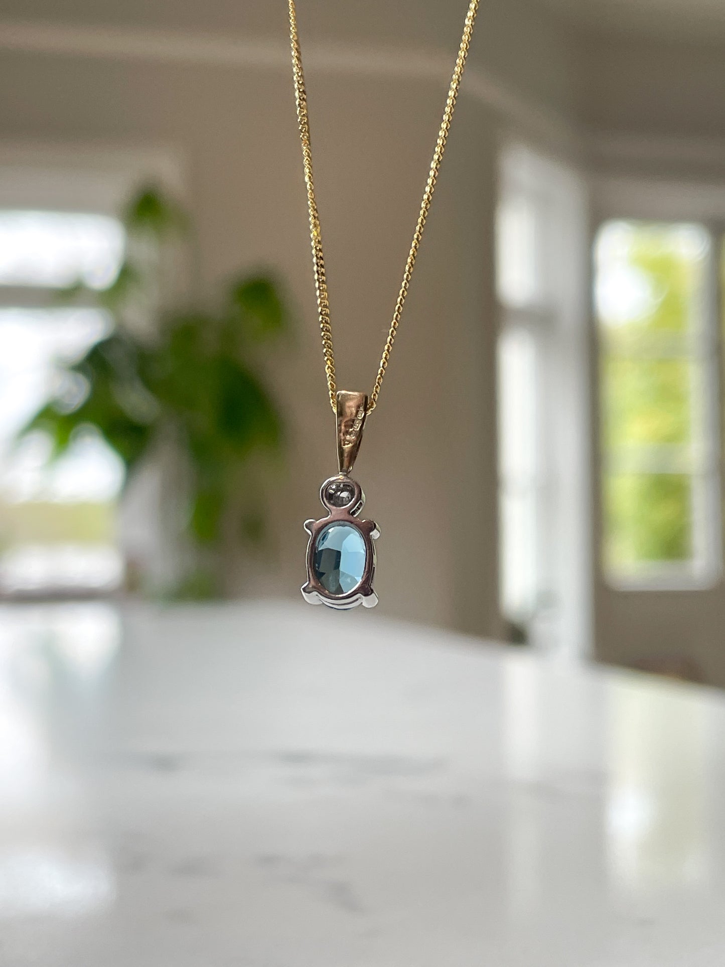 Blue topaz and diamond necklace