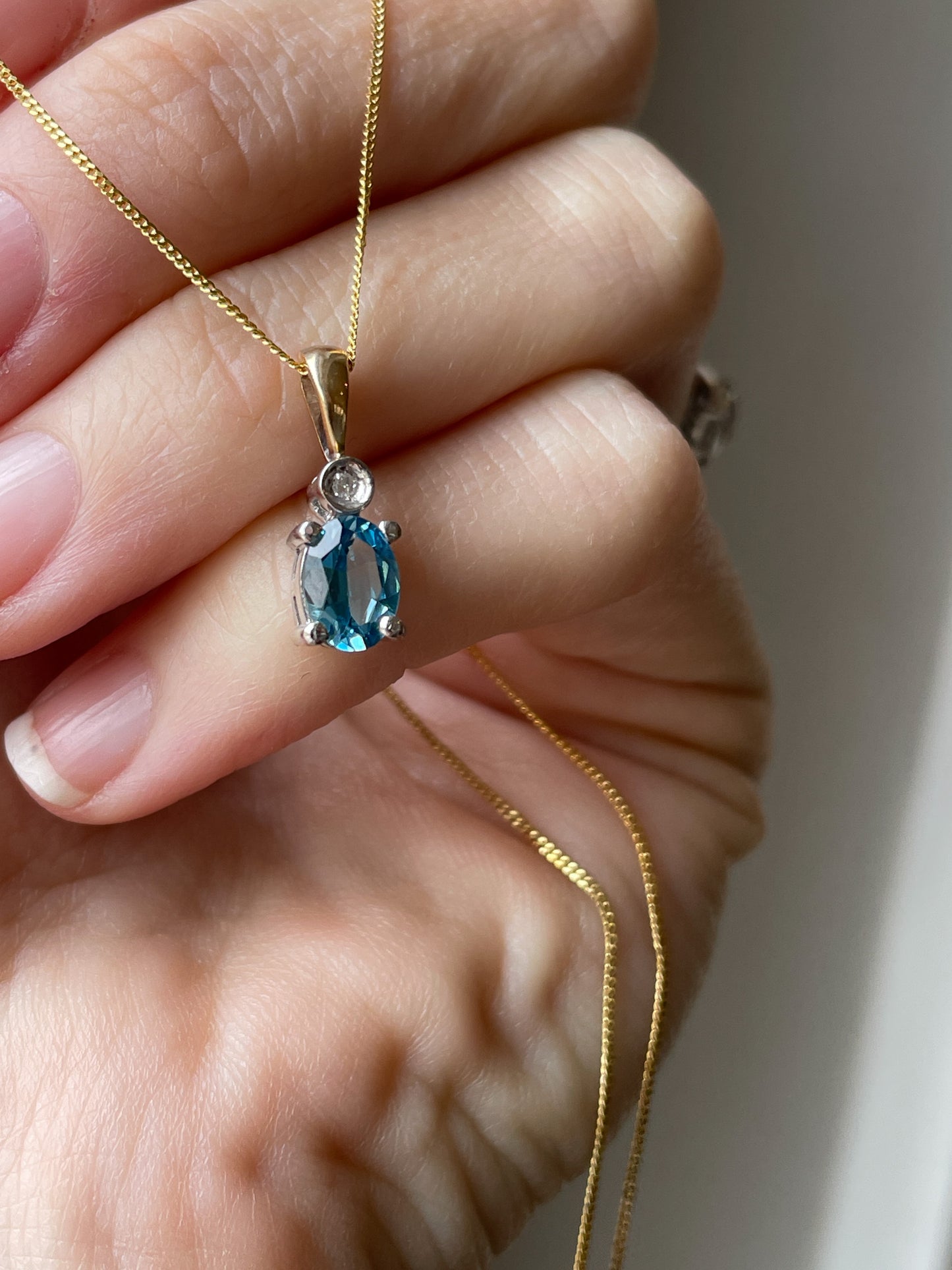 Blue topaz and diamond necklace