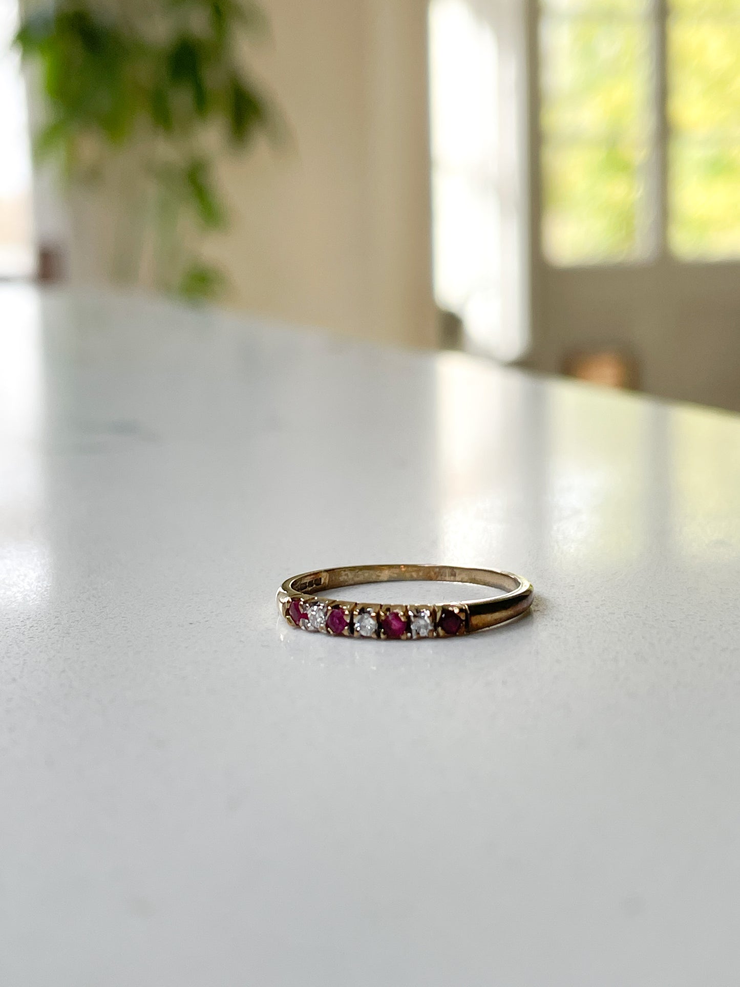 Vintage garnet and diamond half eternity ring