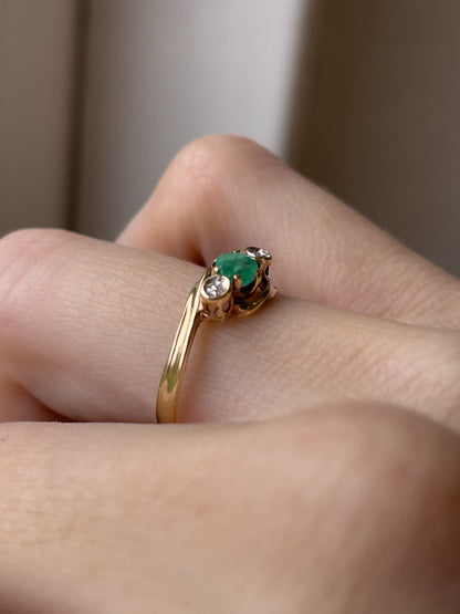 A vintage emerald and diamond trilogy ring on 9ct gold