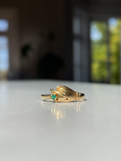 Antique gold hand and emerald ring on 18ct gold