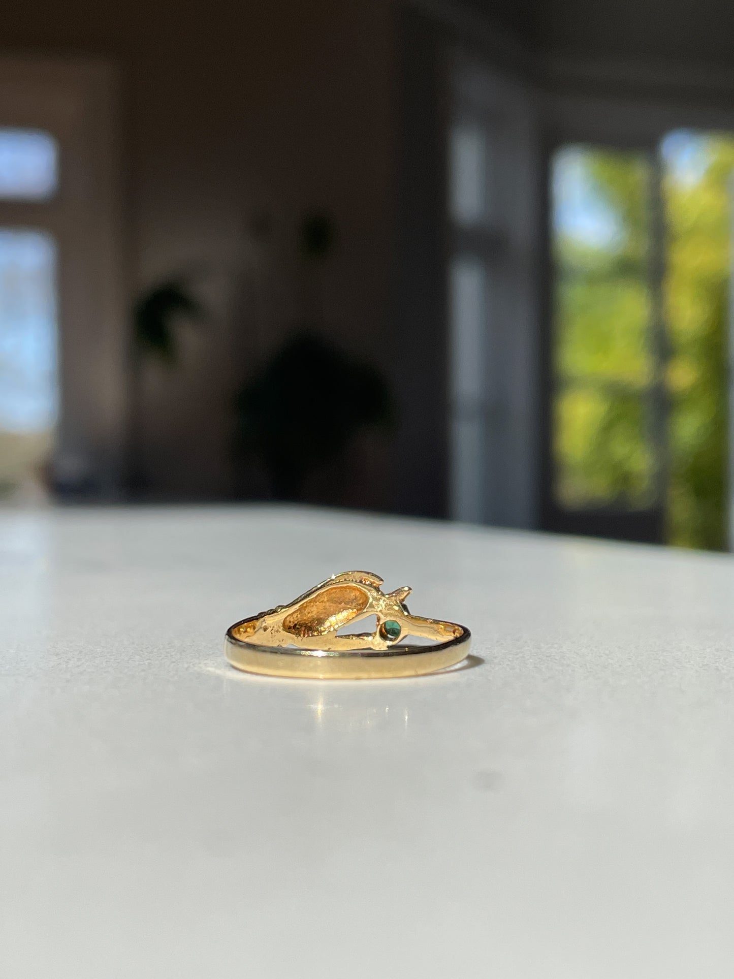 Antique gold hand and emerald ring on 18ct gold