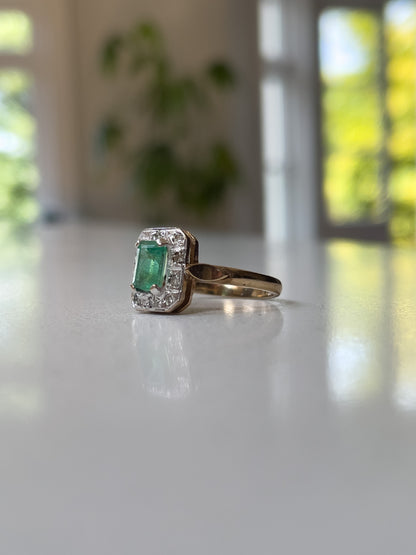 Vintage emerald and diamond halo ring on 9ct gold