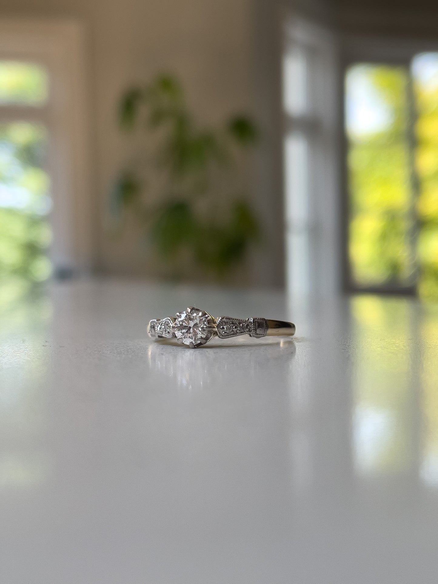 Vintage diamond solitaire ring on 18ct gold and platinum