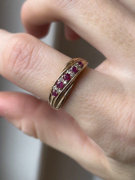 A vintage ruby and diamond crossover band ring on 9ct gold