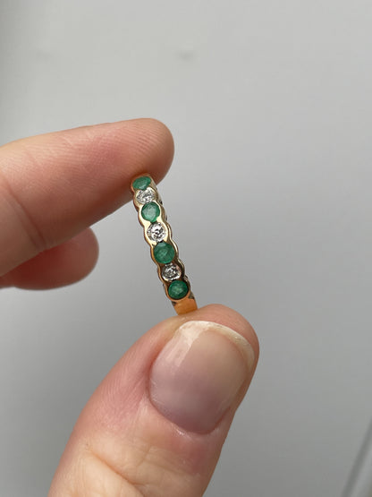 Vintage diamond and emerald 7-stone half eternity ring