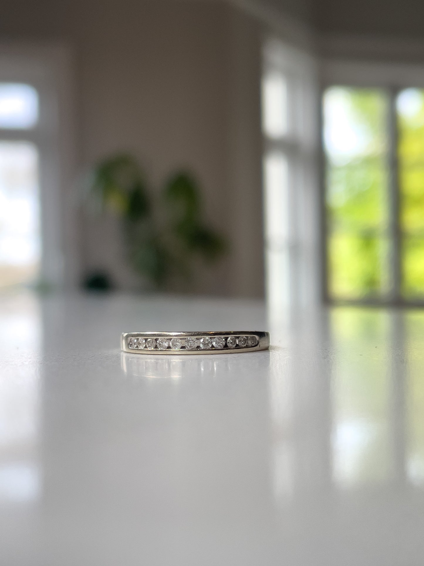 Vintage channel set diamond half eternity ring on 9ct white gold