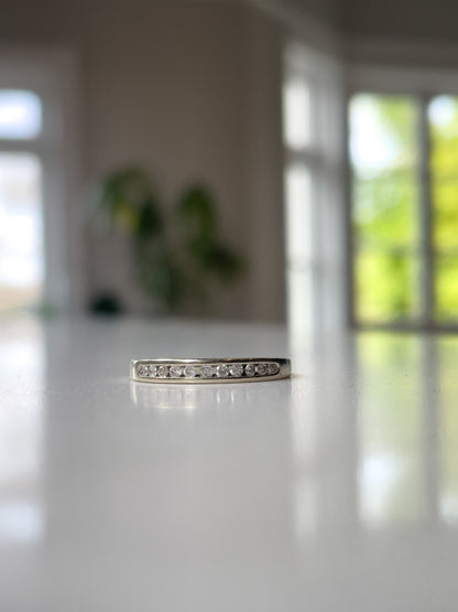 Vintage channel set diamond half eternity ring on 9ct white gold