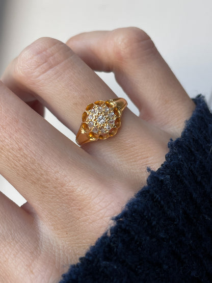 Antique diamond starburst halo ring on 18ct gold