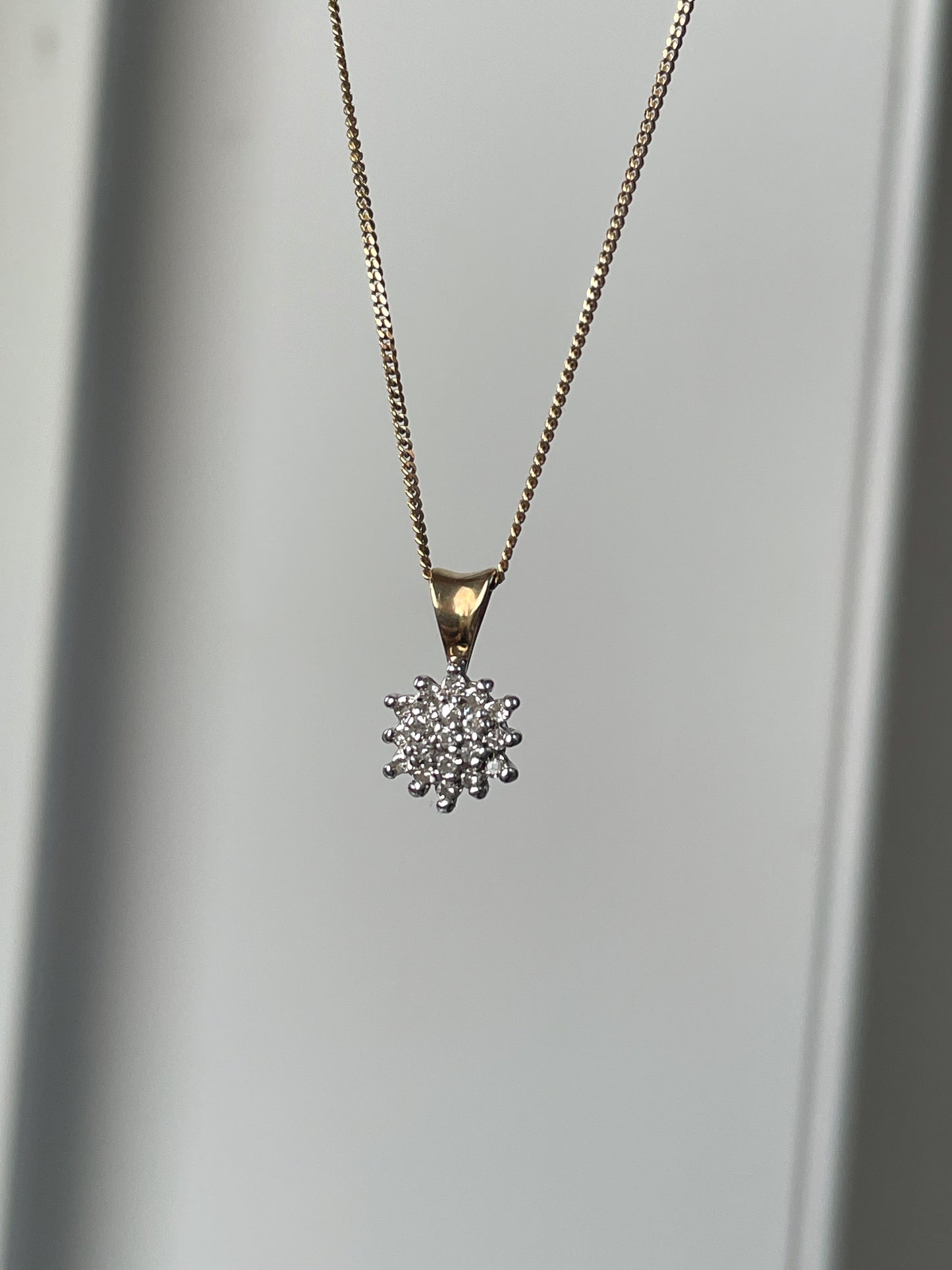 Vintage diamond cluster pendant with 9ct gold chain