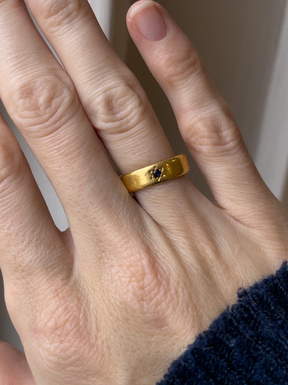 A vintage 22ct gold star set sapphire ring