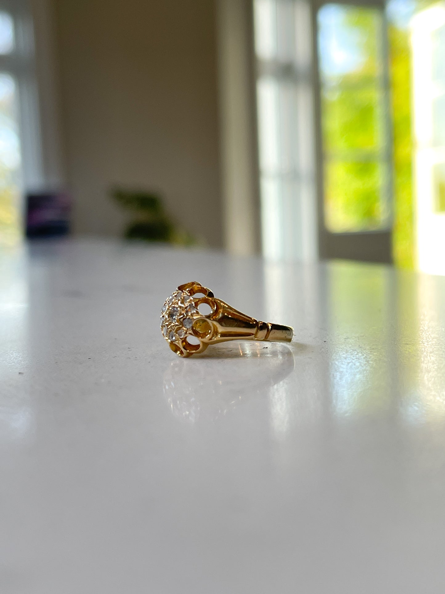 Antique diamond starburst halo ring on 18ct gold