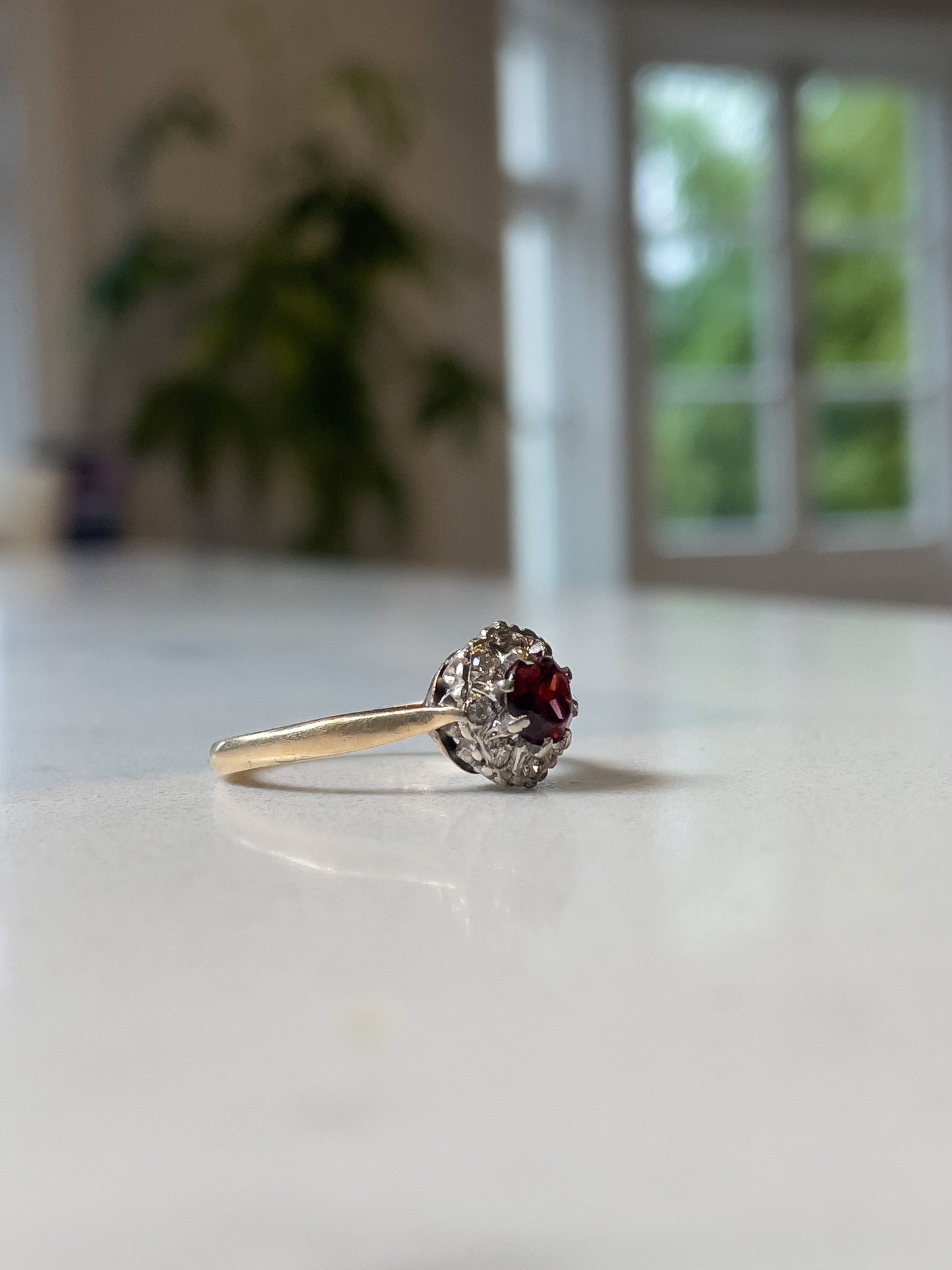 Vintage 1970s garnet and diamond halo cluster ring on 9ct gold