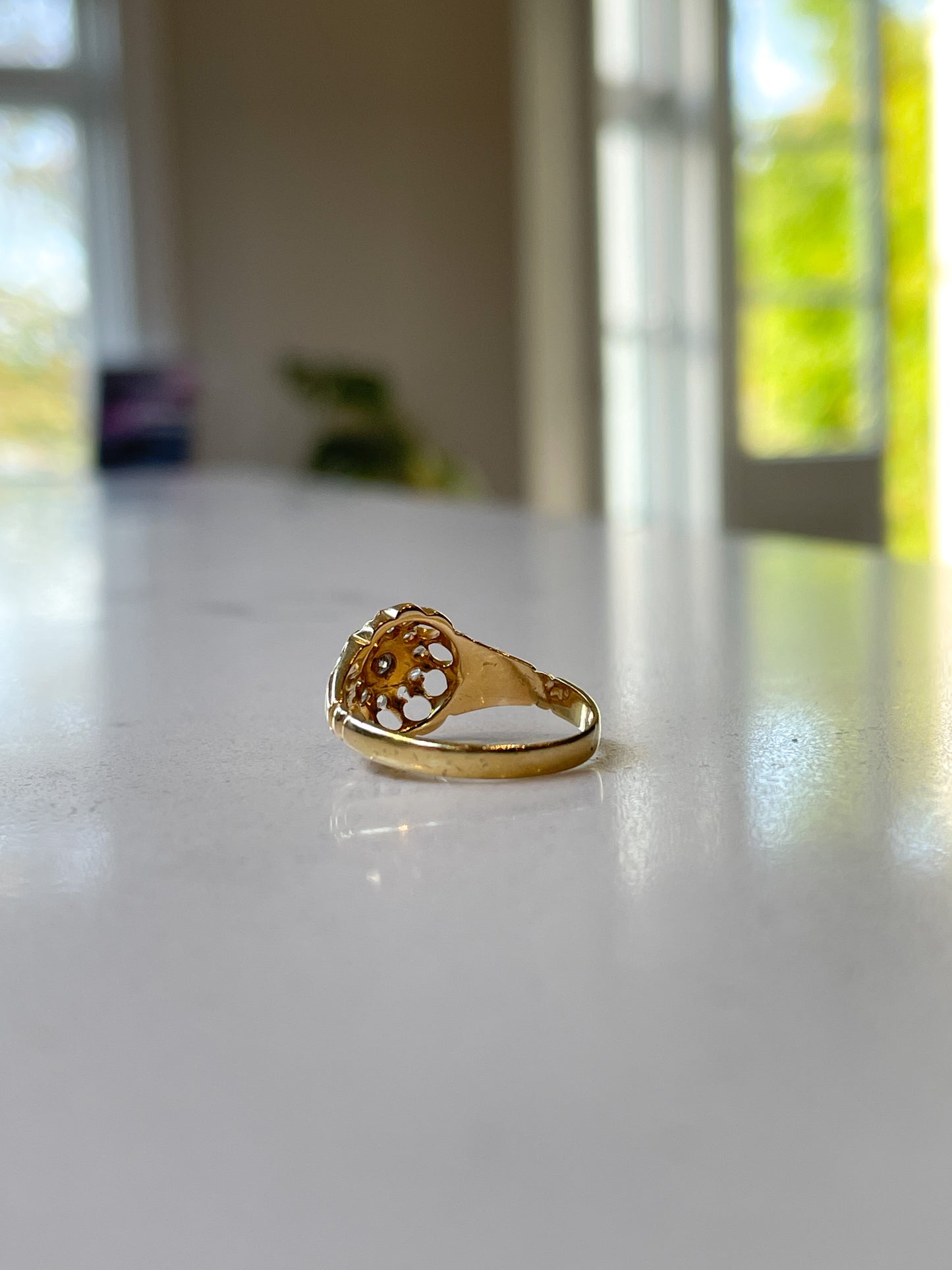 Antique diamond starburst halo ring on 18ct gold